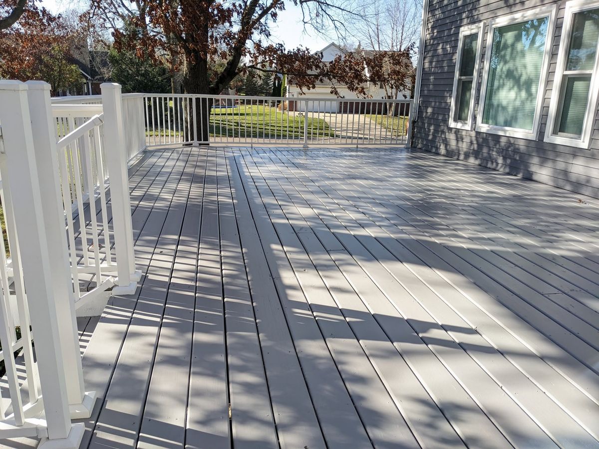 Deck boards and railings coated, edges cut in by hand